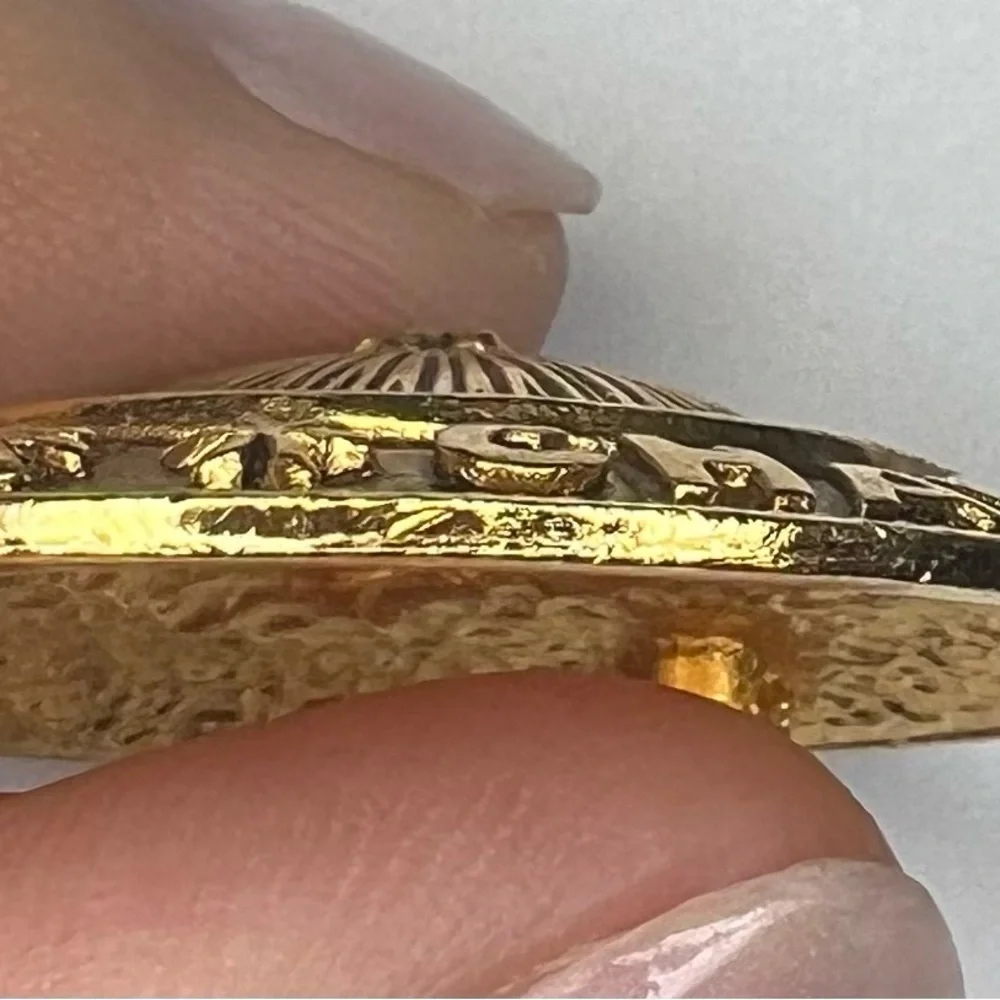Vintage gold Chanel Brooch.